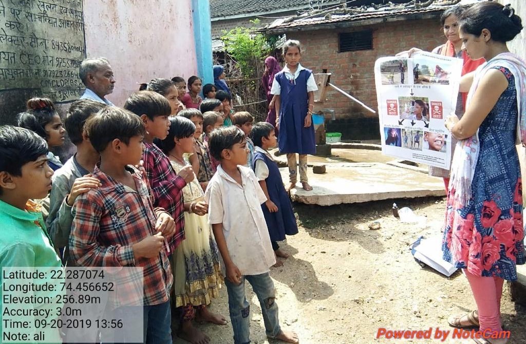 Community children learning about fluoride in India